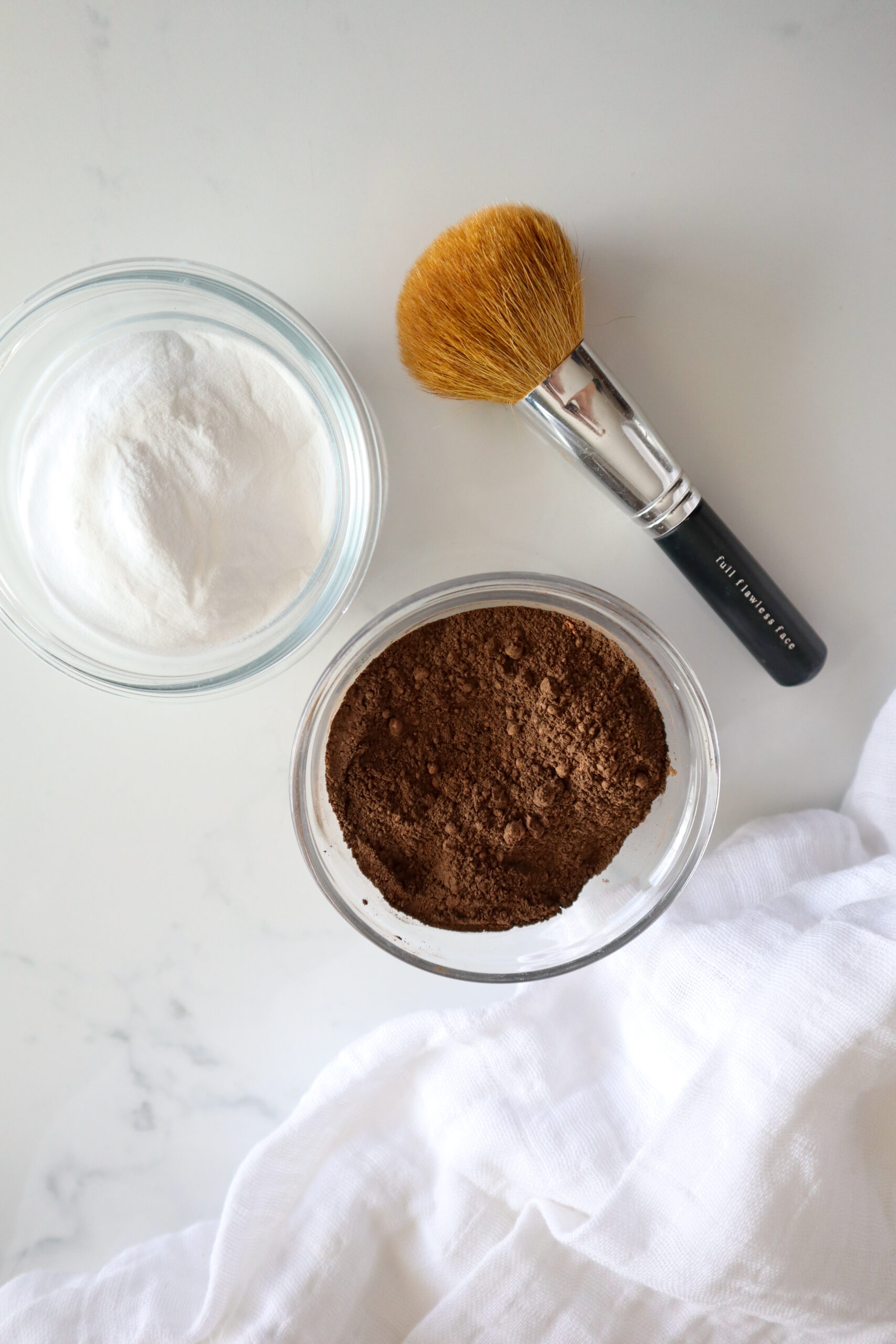 baking powder and cacao powder and makeup brush